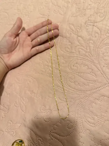 Anéis, cordão e brincos de ouro