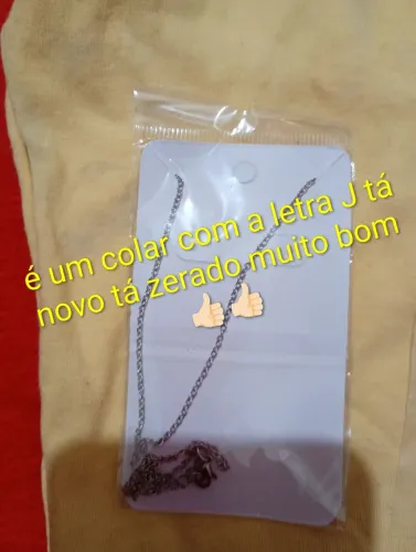 Vendo um colar com dois anel
