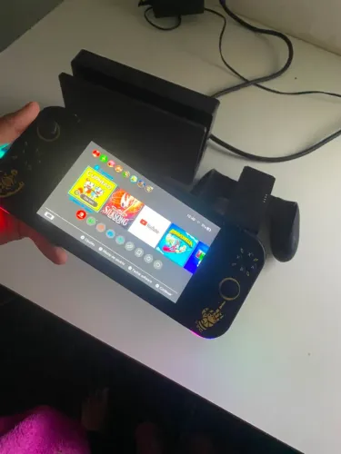 Nintendo switch v2 + caixa + controle extras e cerca de 500 em jogos 