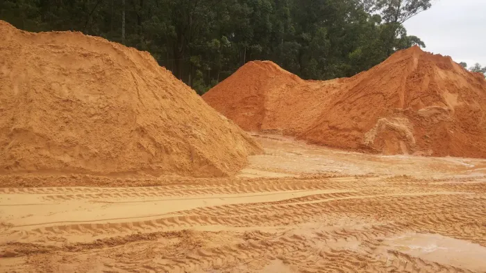 Areia, brita, aterro, concreto lavado etc