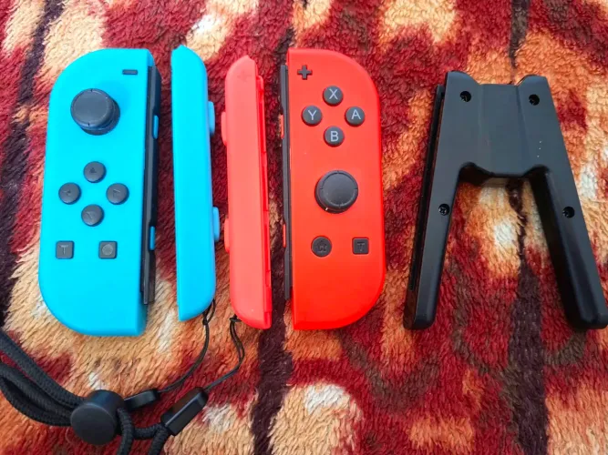 <br><br>Joy-con Switch 1 + Alça de pulso + Suporte Portátil de Carregamento
