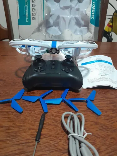 Drone V33 LORDTEC para iniciantes, cor branco e azul,1 bateria, 4 hélices estras,chave fil