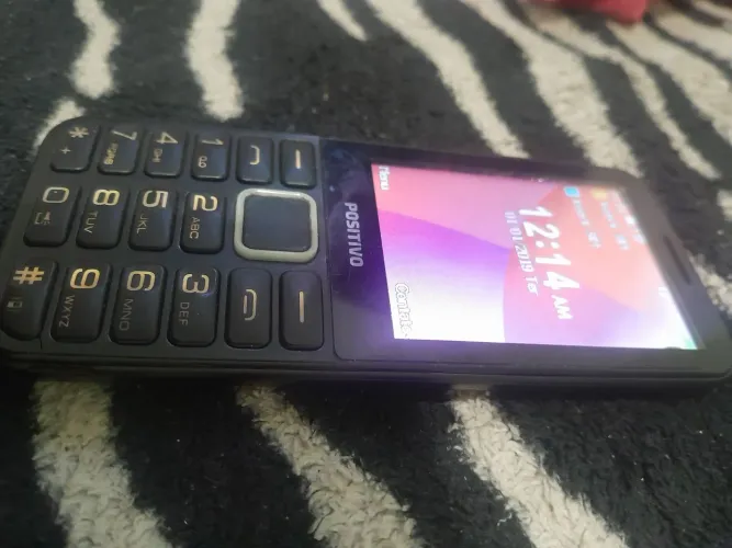 Celular botão com câmera 69$
