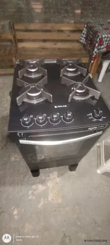 Fogão Atlas 4 bocas elétrico com tampa de vidro funcionando perfeitamente 