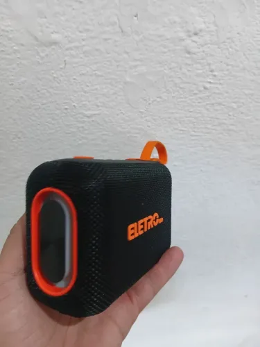 Caixa de som mais carregador portátil 2x1