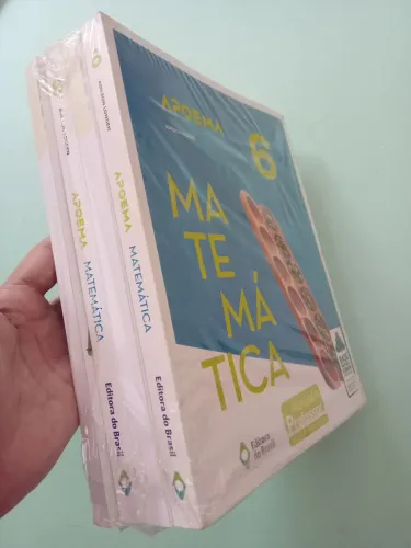 Coleção fechada de quatro livros didáticos de matemática apoema