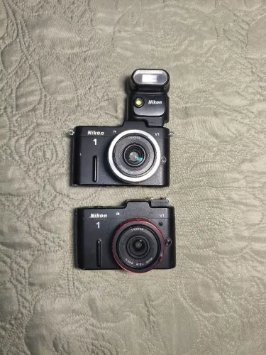 2 câmeras Nikon 1v1