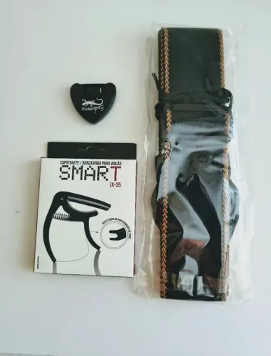 Kit- correia para violão, baixo e guitarra+ capotraste+ porta palheta