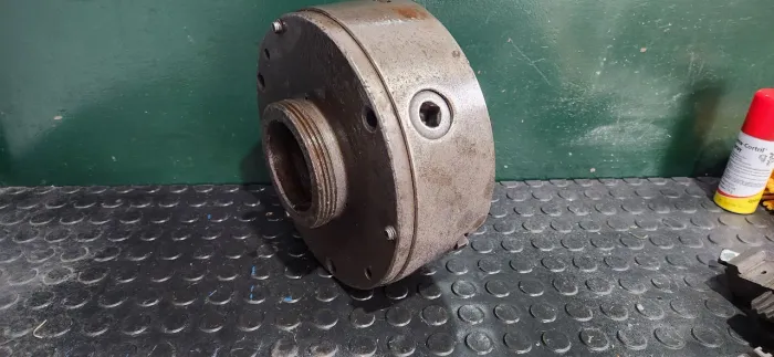 Placa universal 3 castanhas 250mm.  com flange 114mm.  E castanhas alongadas. 