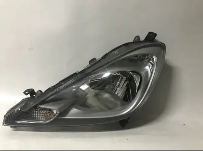 Farol New Fit esquerdo motorista 