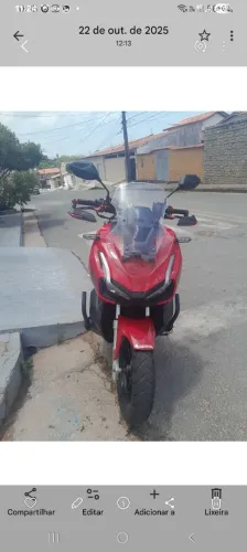 Vendo moto adv bem novinha bem conservada com apenas 18.000 km único dono 