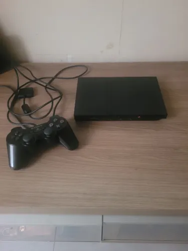 Ps2 mais controles ,memory card e jogos originais