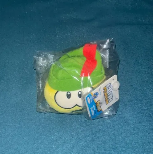Club penguin pelúcia puffle  amarelo robin hood jakks pacific (com moeda e etiqueta)