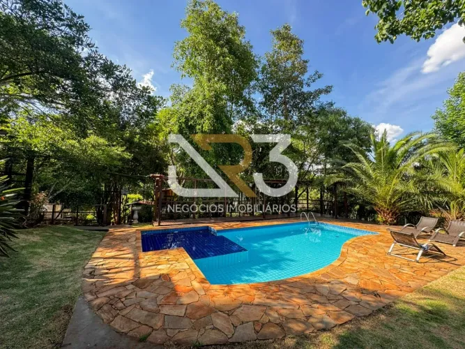 Casa em condomínio para locação no Estância Cabral com piscina aquecida, terreno arborizad