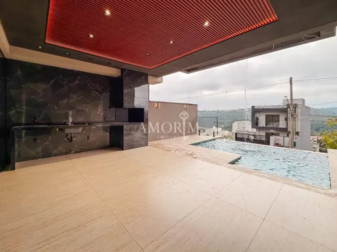 CASA DE ALTO PADRÃO COM PISCINA DE BORDA INFINITA 3 SUÍTES NO PORTAL DOS IPÊS EM CAJAMAR/S