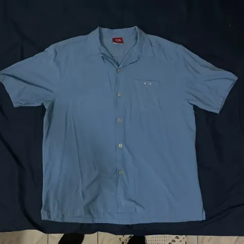 camisa oakley 90s manga curta azul aço c/ logo metálico