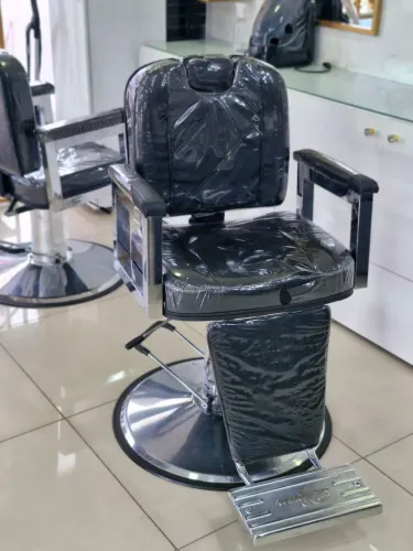 Cadeira para barbeiro ou cabeleireiro.