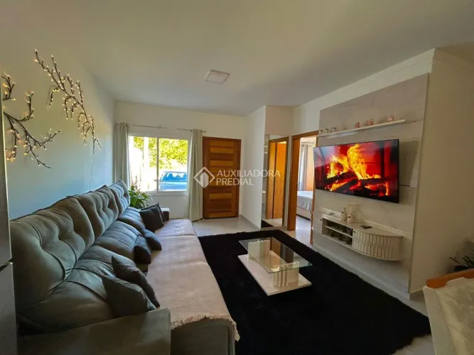 Casa de condomínio à venda na Lomba do Pinheiro, 3 dormitórios, área de 78 m².