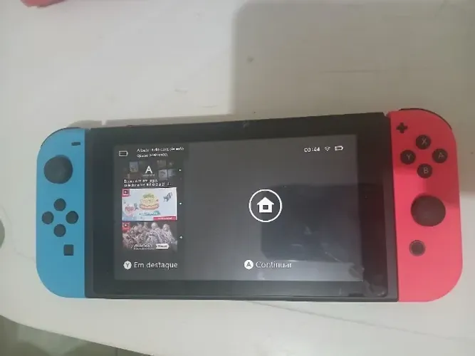 Vendo Videogame Nitendo Switch semi novo com 10 jogos, Doca, controles e carregador.