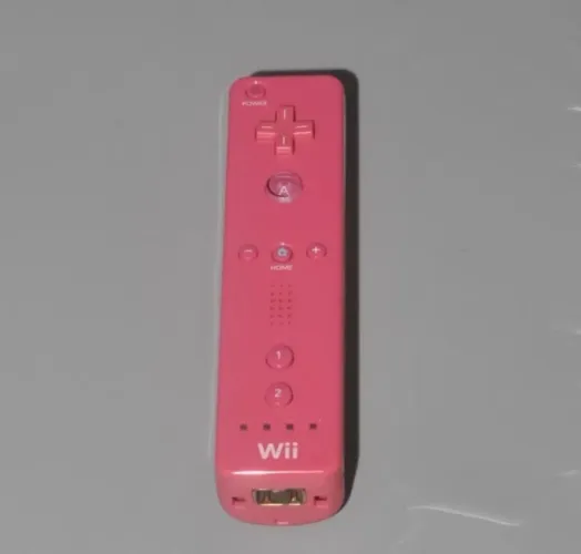 Controle original Nintendo Wii remote rosa.