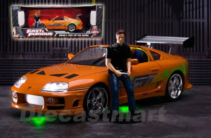 VELOZES E FURIOSOS 1995 TOYOTA SUPRA 1/18 COM LUZES E FIGURA DO BRIAN LARANJA
