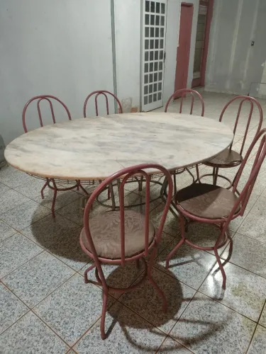Mesa de Jantar Oval em Pedra Natural com 6 Cadeiras<br>Descrição:
