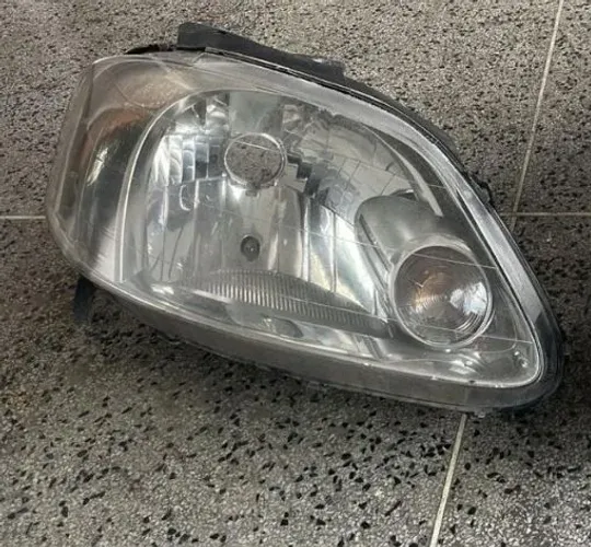 Farol paralelo fox 2009  lado passageiro 