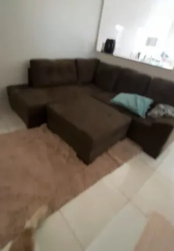 Sofá grande em L com apoio