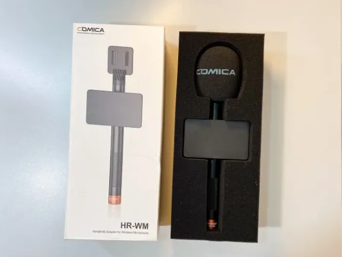 O Comica HR-WM é um adaptador portátil de mão que transforma um microfone de lapela sem fi