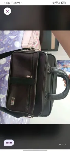 Bolsa de couro, com avarias,Entre 37 cm e 42 cm.