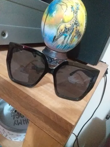 Óculos importado de Sol. "Troco".