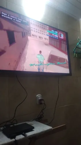Vendo essa PS2 com várias tipo de jogo indo junto
