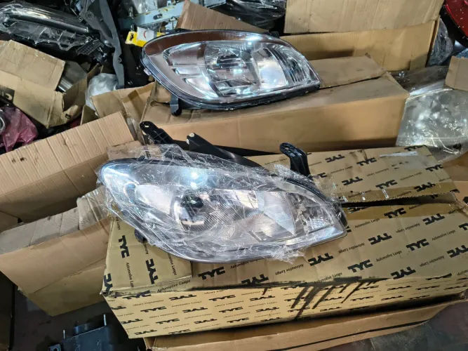 Farol direito Celta Prisma cromado 07/15 NOVO 