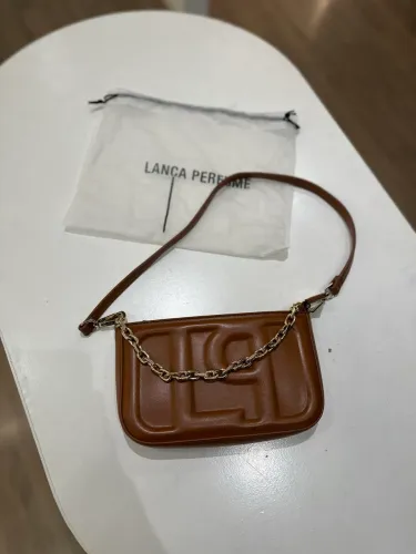 Bolsa original lança perfume toda no couro nova