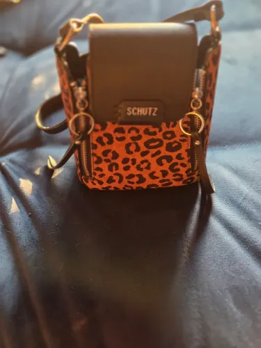 Bolsa transversal Schutz oncinha