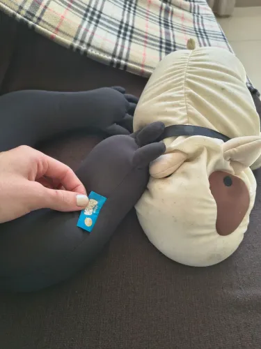 Almofada massageadora Uatt + pelúcia cachorro Imaginarium