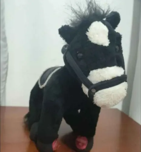 Brinquedo cavalo de pelúcia eletrônico que faz barulho