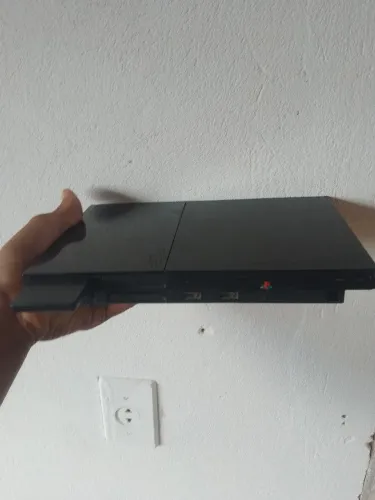 Ps2 perfeito,dois controles dual chock original (um deles e o prata),memory card e uns jgs