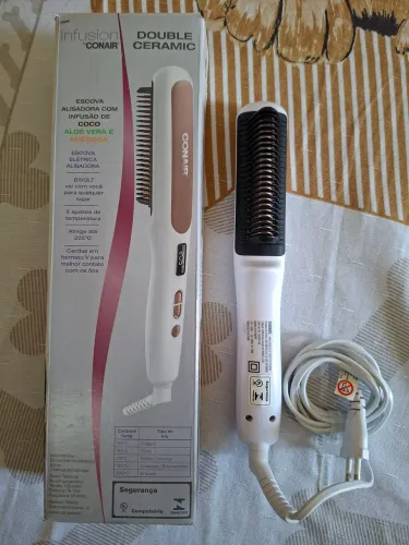 Escova Alisadora semi nova.