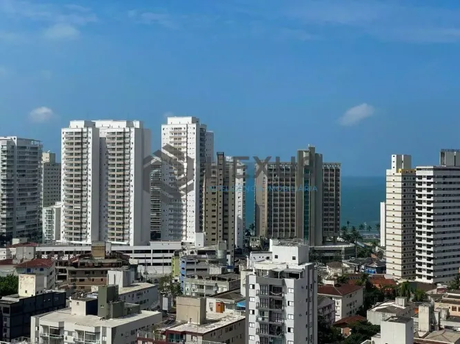Apartamento com varanda e lazer de clube na Praia das Asturias, Guaruja