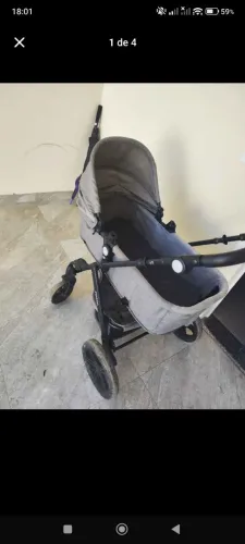 Carrinho de bebê com bebê conforto cosco