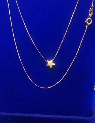 Gargantilha Com Estrelinha Fixa Peso 1.14 Gramas 40 Cm x 0.5 mm Ouro 18 Kilates           