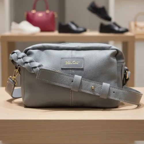 bolsa nova mr cat crossbody em couro legítimo muito macio na cor cinza