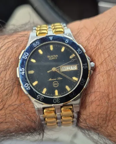 Relógio BULOVA Marine <br>QUARTZ<br>45<br>WED 10-<br>Marine LlarBULOVA<br>QUARTZ<br>45<br>WED 10-<br>Marine Llar