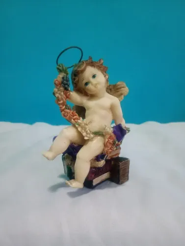 Delicado anjinho com livros em resina - Bibelô 
