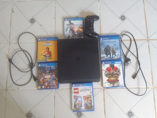 PS4 slim 1TB usado com 1 controle Com 6 jogos