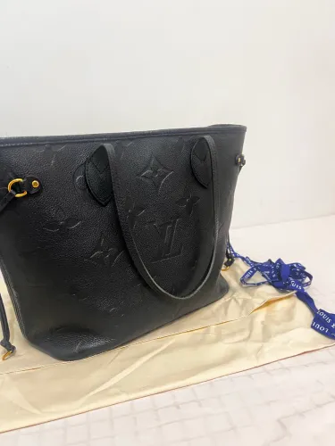 Bolsa Louis Vuitton Neverfull MM em couro Monogram Empreinte, preta (Noir)