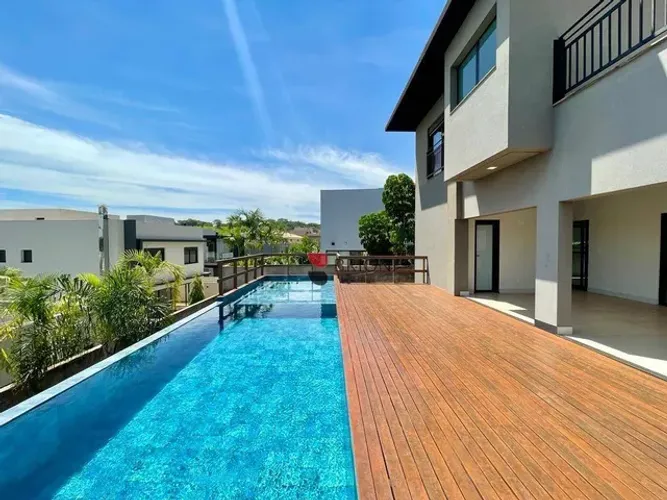 Sobrado alto padrão, com 402m², 4 quartos/suítes, no Condomínio Alphaville 1 I Imobiliária