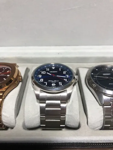 Relógio orient fundo azul