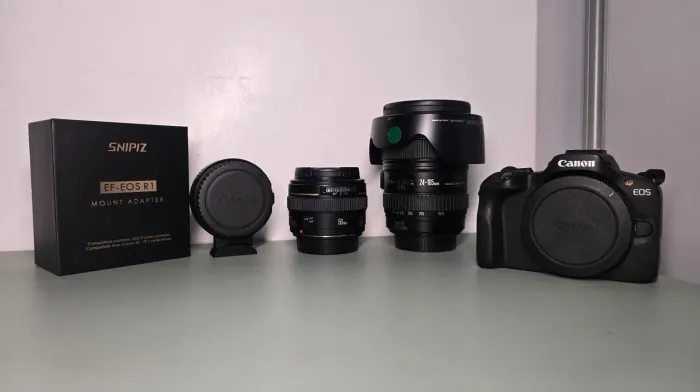 Canon R100 + 24-105 F4L + 50 F1.4 + Adaptador EF + Flash.